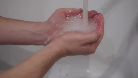 Hands of a man under a tap with running water Stock Footage 155242380