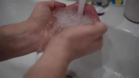 Hands of a man under a tap with running clear water Stock Footage 155405685