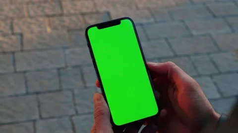 Hands man use phone with vertical green screen stand on street outdoors Stock-Footage 145850679