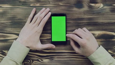 Hands of man using mobile with green screen. Stock Footage 86966570