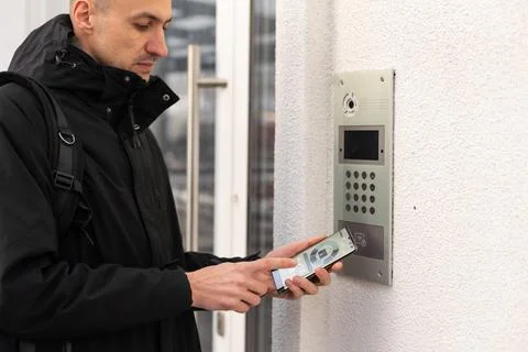 Hands man using security control application on smartphone when locking Stock Photos