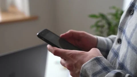Hands of a man using a smartphone Stock Footage 149138344