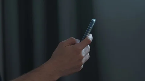 Hands of man using smartphone in home. Stock Footage 113444441