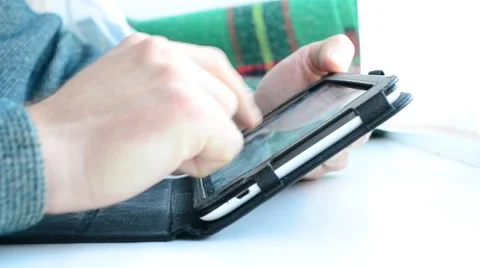 Hands of a man using tablet at home Stock Footage 67602157