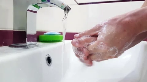Hands of man washing hands under the water tap. Stock Footage 142218776