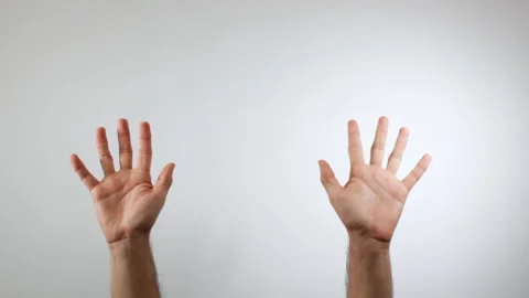 Hands of a man waving or saying goodbye on a white background Stock-Footage 137426509