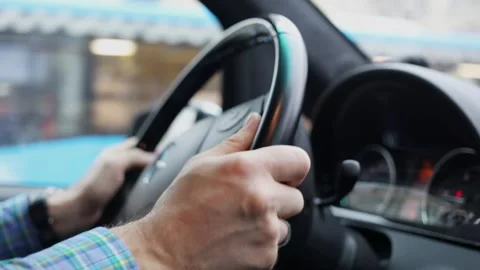 Hands of man which rotates steering wheel during Stock Footage 299678818
