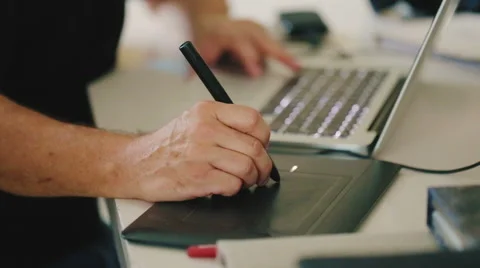 Hands of a man working with drawing tablet 库存影片 58947988