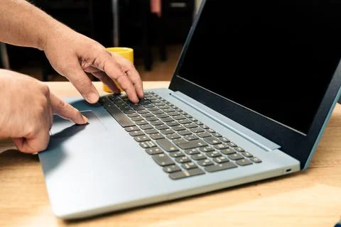 Hands of a man working with his laptop. Technology concept, homeoffice Stock Photos