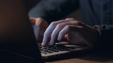 Hands of a man working on laptop at night. Stock Footage 101089505