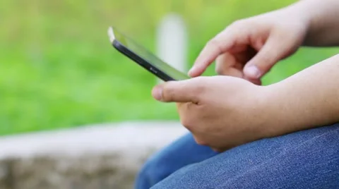 Hands of man working with tablet PC in summer park Stock Footage 57198274