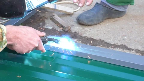 Hands of a man working with a welding machine Stock Footage 117370268