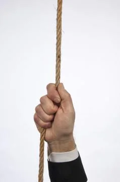 Hands of manager hanging on a rope Stock Photos