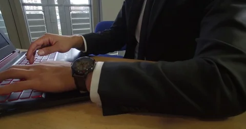 Hands Of a Manager Typing On a Computer Keyboard Stock Footage 123512974