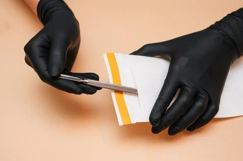 The hands of the manicure master remove the manicure and pedicure tools in a Stock Photos