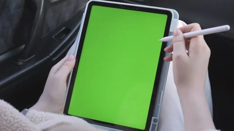 Hands manipulate tablet with green screen Stock Footage 340957316