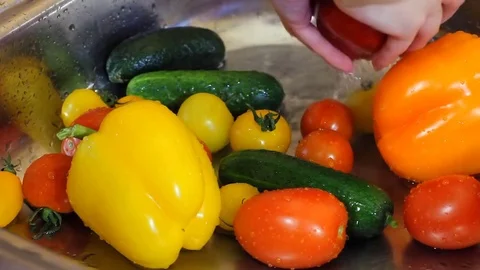 Hands marked by work and by the time of an experienced farmer cleaned by mother Stock Footage 77357497