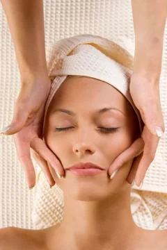 Hands massage on face Stock Photos
