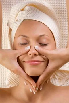 Hands massage on face Stock Photos