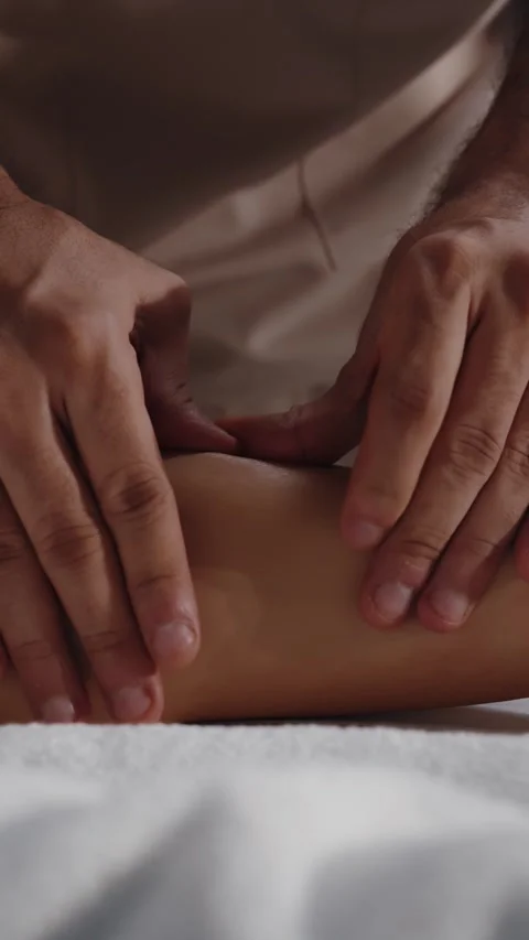 Hands Massaging Lower Leg During Spa Procedure 스톡 동영상 313799141
