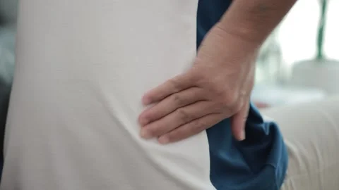 Hands massaging the spine, back pain, waist pain Stock Footage 310864756