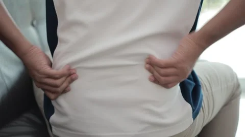 Hands massaging the spine, back pain, waist pain Stock Footage 310864778