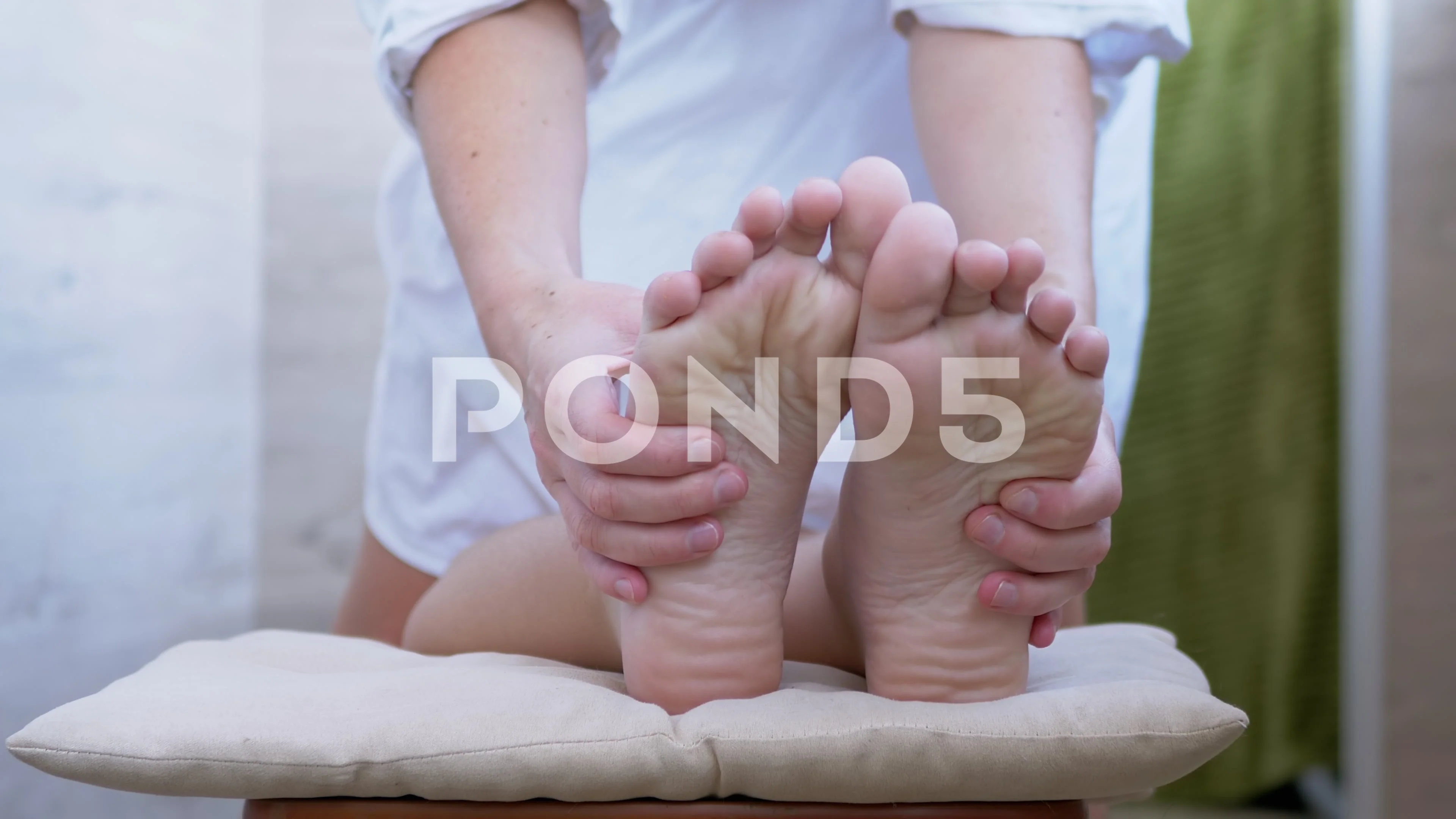 Hands of a Masseur, Therapist are Massaging Bare Feet, Soles of a Child. 4K