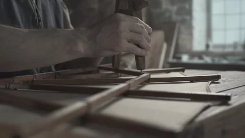 Hands of a master checking a glider wing model with a wooden divider tool Vídeo Stock 340322734