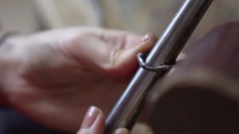 Hands of master goldsmith working process. Craft jewelry, making a silver ring Stock Footage 141034385