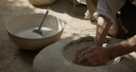 Hands of a master potter working on a potter's wheel in the manufacture of Stock Footage 249815859