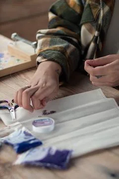 The hands of the master string beads on a string Stock Photos
