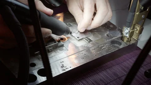 With the hands of the master we solder the part Stock Footage 157449277