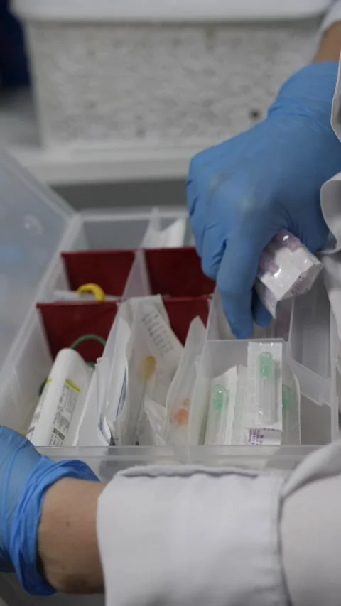 The hands of a medical worker take a syringe out Stock Footage 240763540