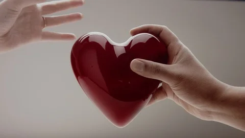 The hands of men and women tear the heart in half Stock Footage 86617543