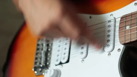 Hands men close-up playing guitar Stock Footage 114327254