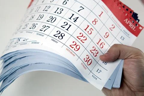 Hands of men hold the sheets of the calendar Stock-Fotos