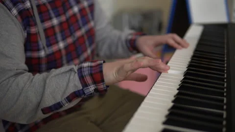 Hands of men play on the electronic synthesizer Stock Footage 88323642
