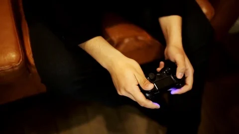 Hands of men play on the joystick to the console Stock Footage 73380622