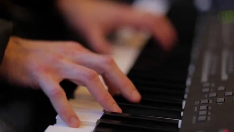 Hands of men play on the synth. Video stock 72648525