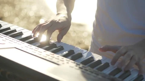 Hands of men play on the synth. Man hands playing a MIDI controller keyboard Stock Footage