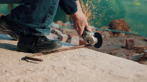 Hands, metal and grinder at construction site to cut material with power tools Stock Footage 336193166