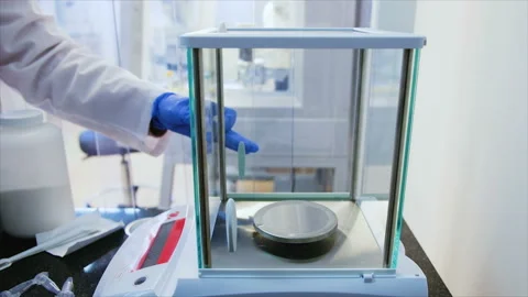 Hands of a microbiologist in gloves put a test tube Stock Footage 103702006