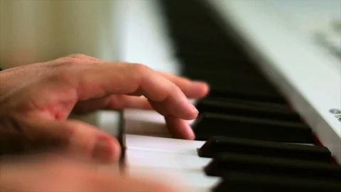 Hands of a middle aged man playing the piano. Stock-Footage 88407207