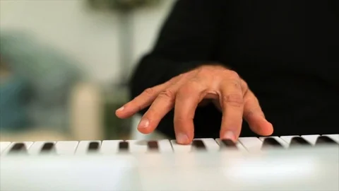 Hands of a middle aged man playing the piano. 스톡 동영상 88407239