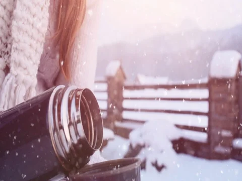 Hands in Mittens pouring Steaming Tea to Cup from Thermos, Winter. 4K SLOW-MO 動画素材 70568829