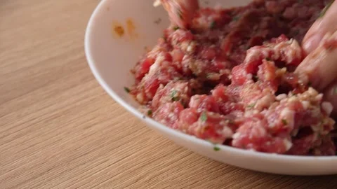 Hands mix ground meat. Stock Footage 256243216