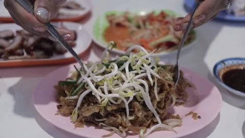Hands Mix Thai Stir Fried Pad Mee Korat Noodles In Isaan Street Food Restaurant Stock Footage 237587688