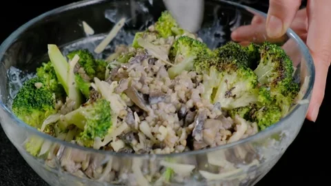 Hands Mixing Broccoli Mushroom Meat Salad in Bowl Cooking Video stock 341431990
