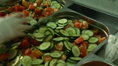Hands mixing fresh cut vegetable in canteen Stock Footage 82589011