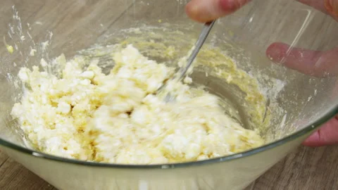 Hands mixing ingredients in a bowl. Stock Footage 266424985